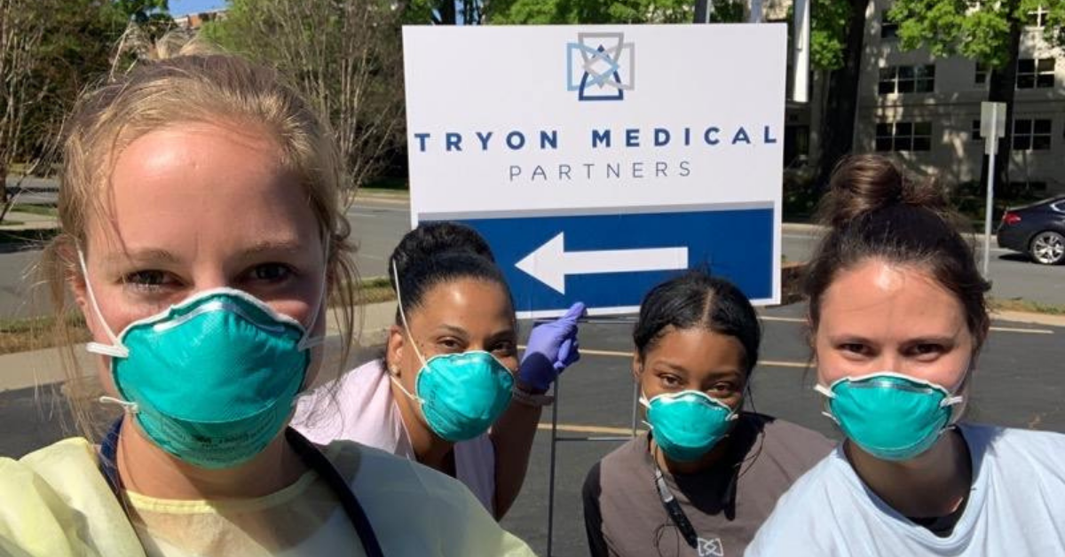 Tryon Medical Partners doctors and nurses pose outside a satellite testing facility for COVID-19